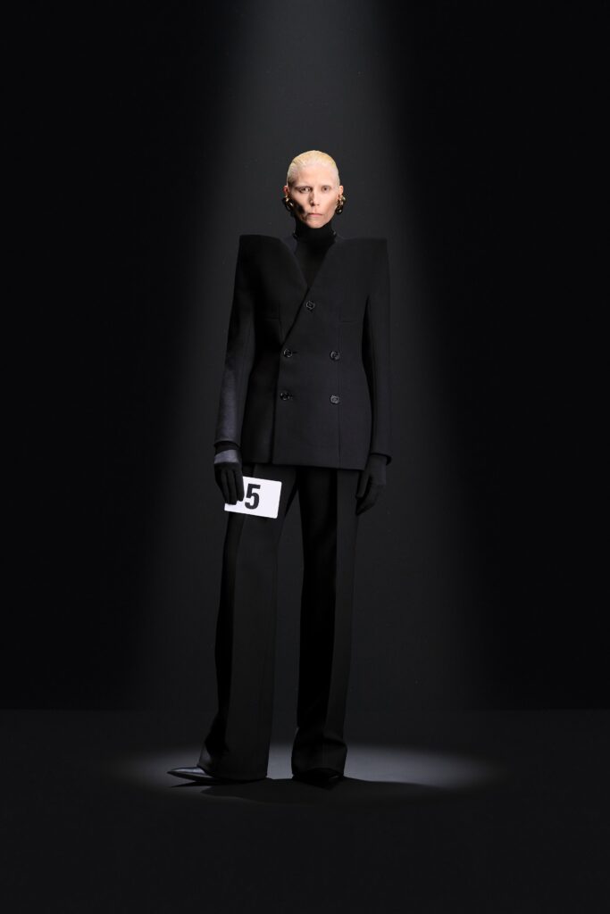 black tailored suit with gloves