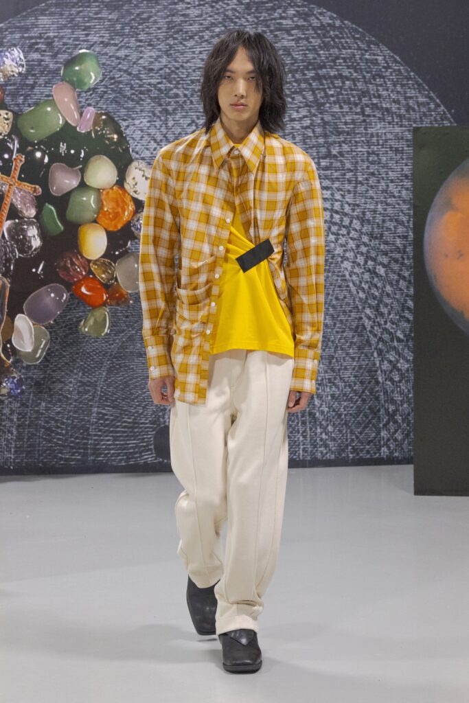 A relaxed fit long-sleeve checked shirt paired with relaxed pants in a vibrant yellow and brown color scheme.