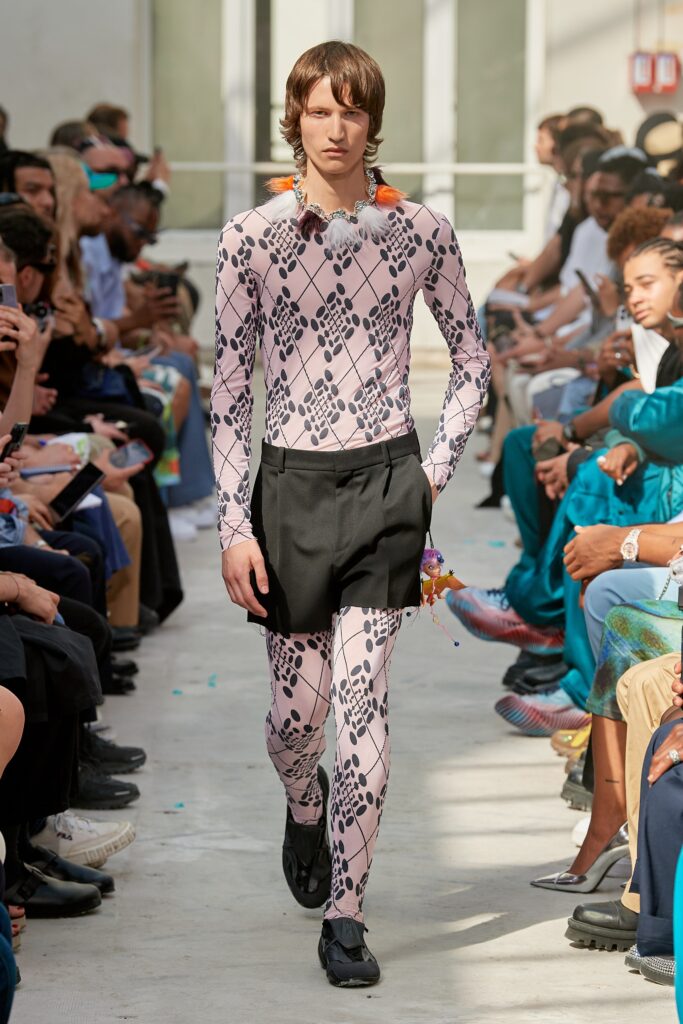 pink printed catsuit with black skirt