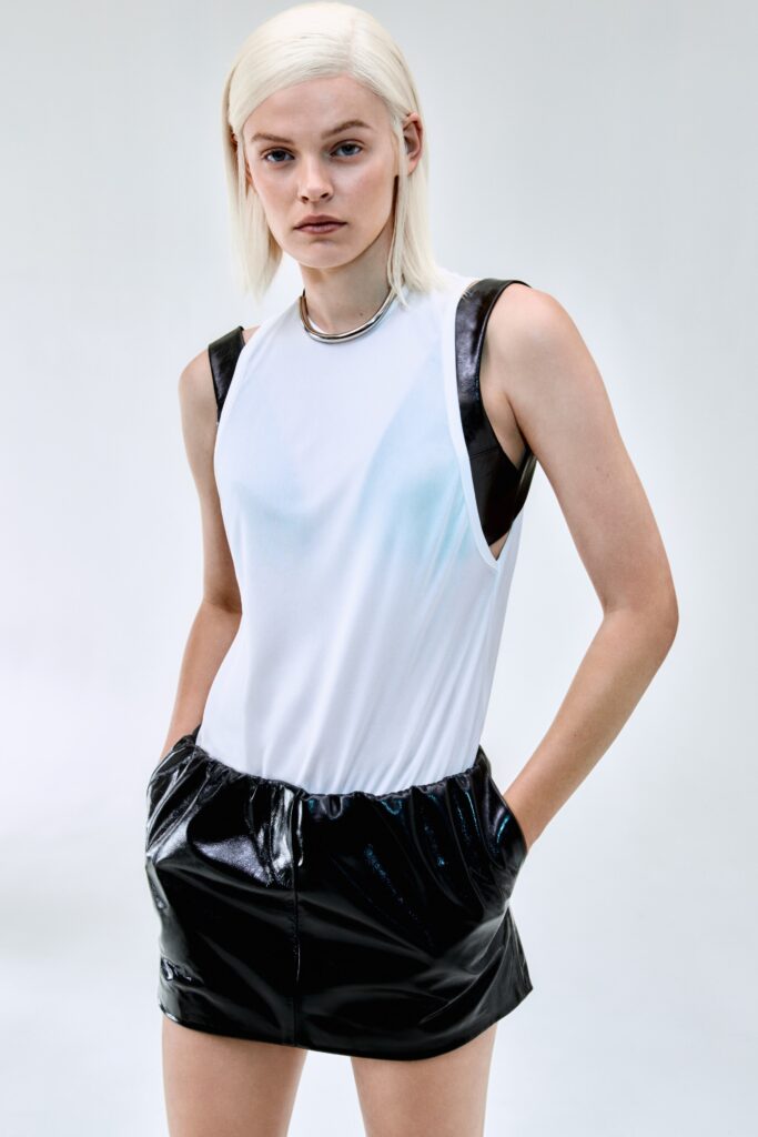 fitted white top and black shorts