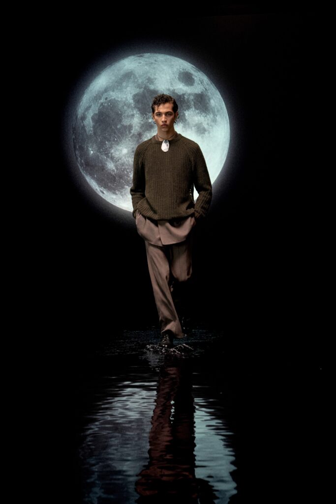 green wool relaxed sweater and beige tailored pants