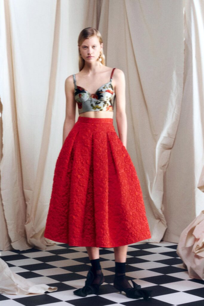 embroidered silk top and pleated midi skirt