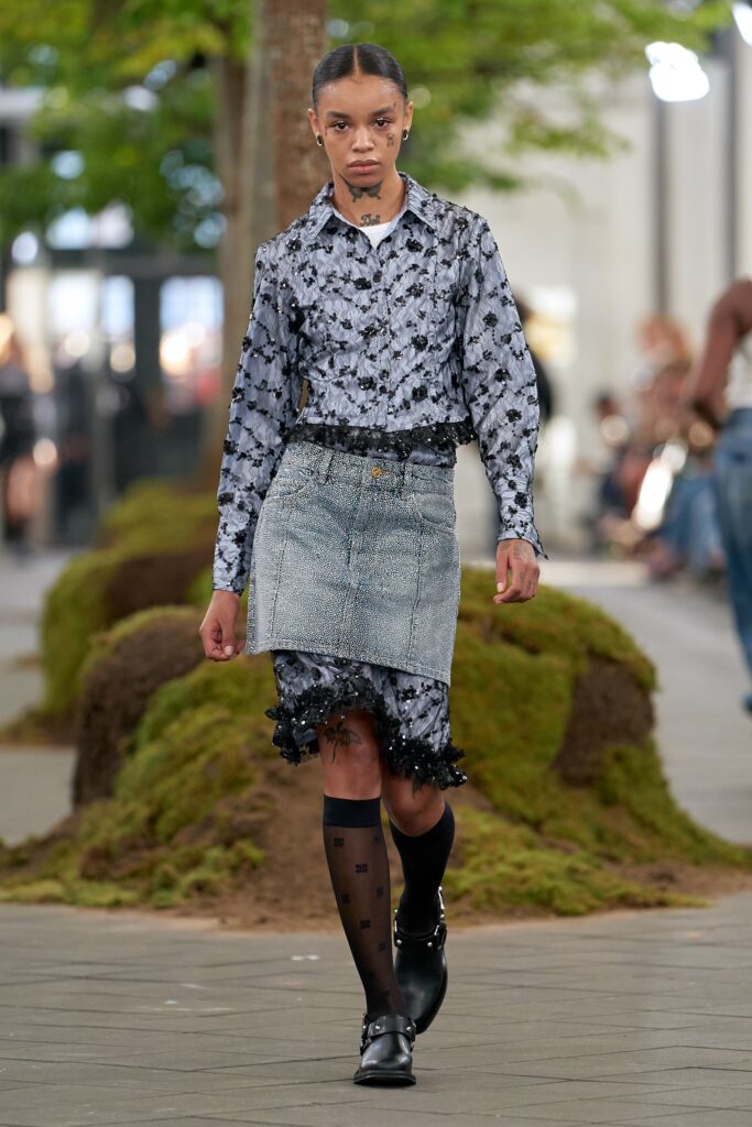 black and white embroidered shirt with denim skirt