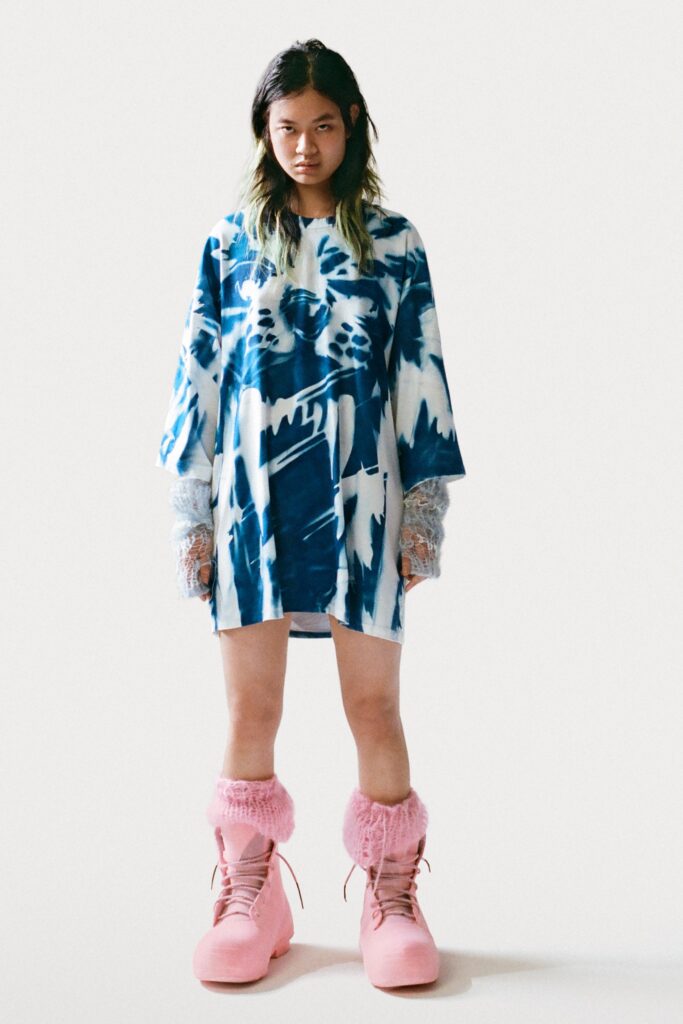 An oversized blue cotton dress with short sleeves and a relaxed fit.