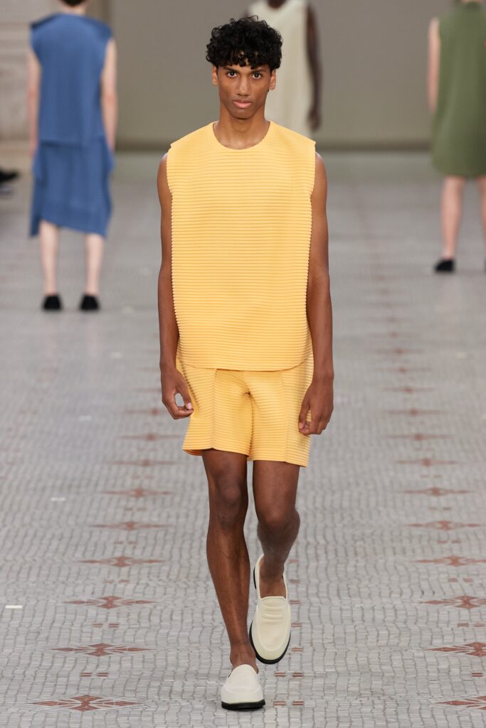 A relaxed yellow striped sleeveless top paired with matching shorts for a casual look.