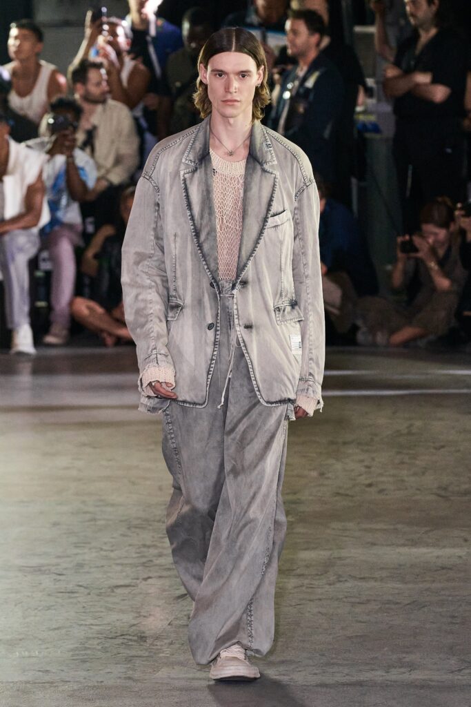 A relaxed gray denim suit with long sleeves and wide-leg trousers.