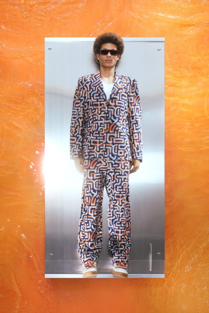 A fitted multicolor printed suit with long sleeves and a collared design.