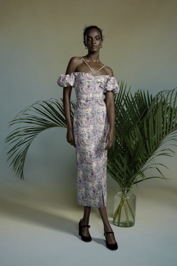 A fitted multicolor off-shoulder dress with a flared silhouette.