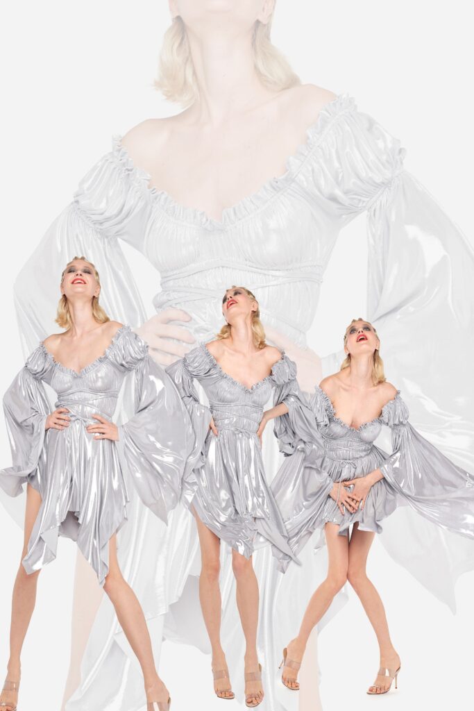 A fitted silver satin dress with a V-neckline and ruffled, asymmetric design.