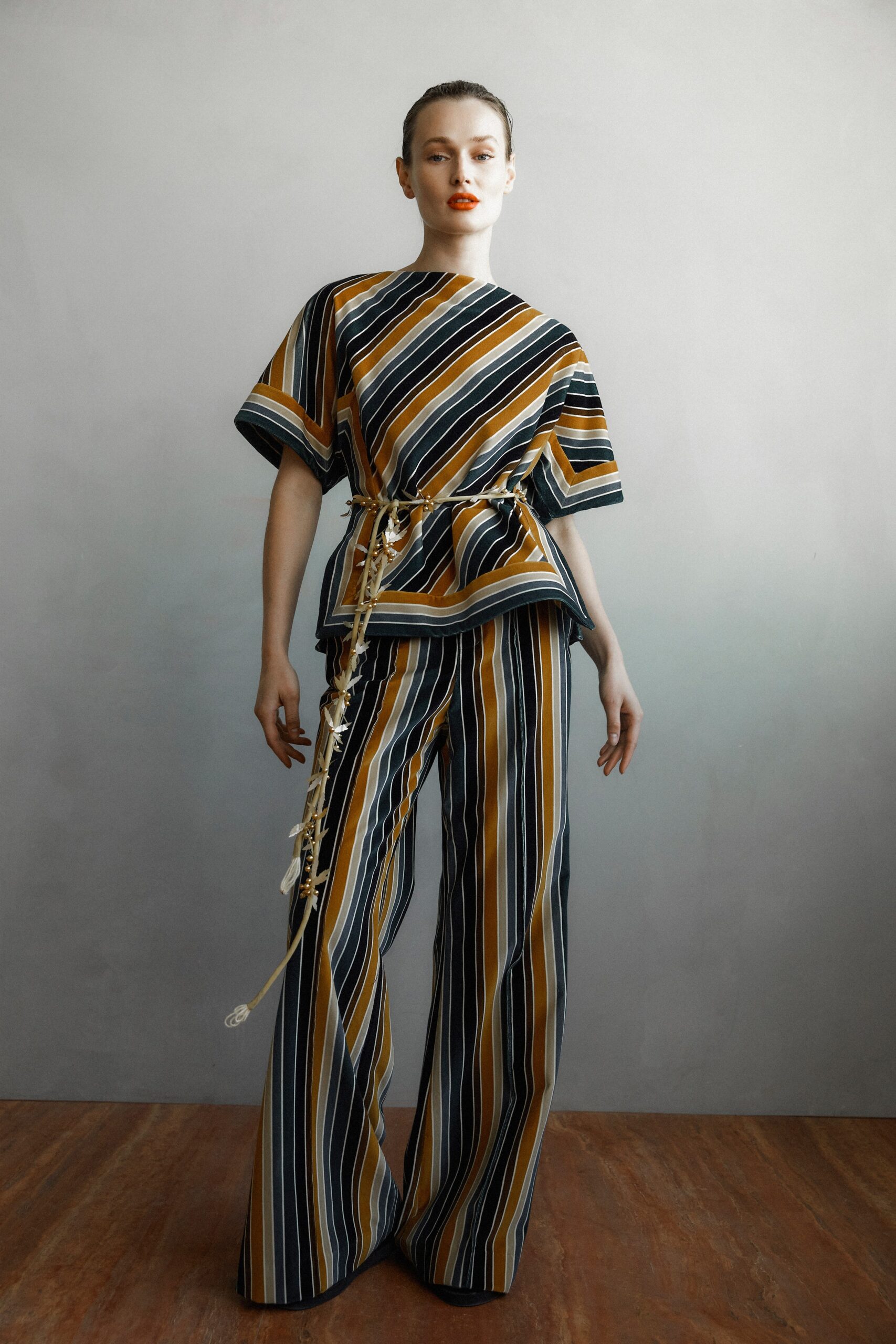 A relaxed striped top with short sleeves paired with matching striped pants.