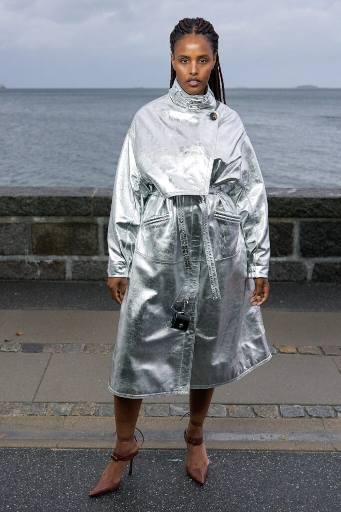 A relaxed silver metallic coat with long sleeves and a belted design.