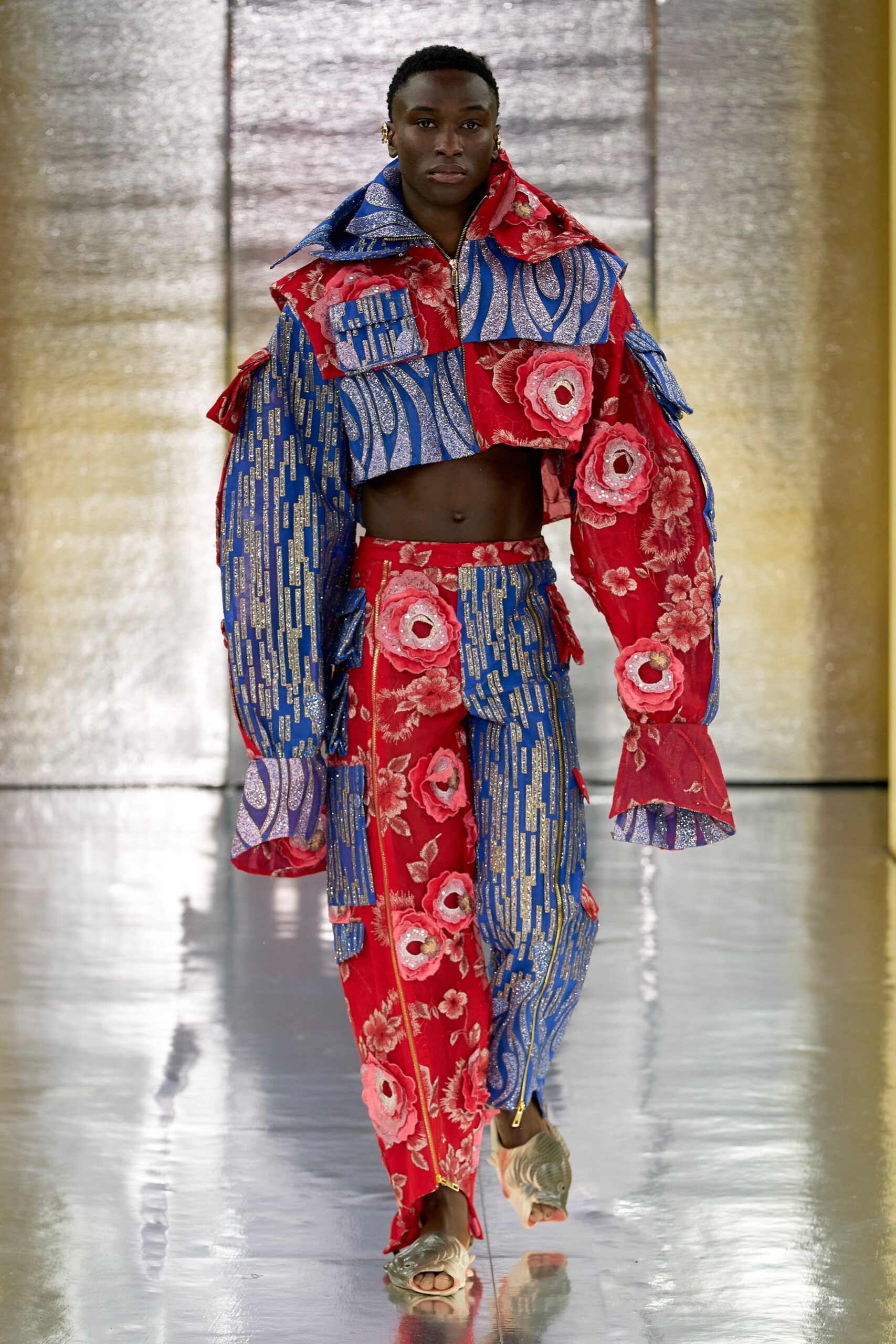 A relaxed fit printed jacket with long sleeves and matching pants featuring vibrant colors.