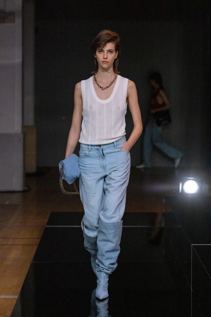 A relaxed blue denim sleeveless top paired with straight-leg denim pants.