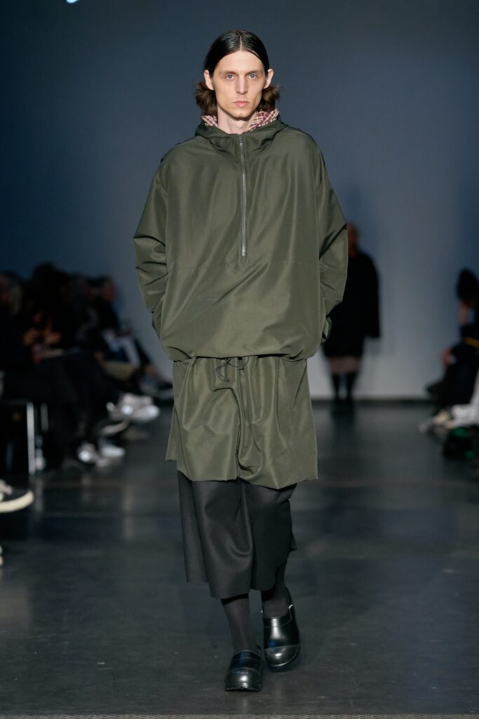 green relaxed hoodie with black skirt