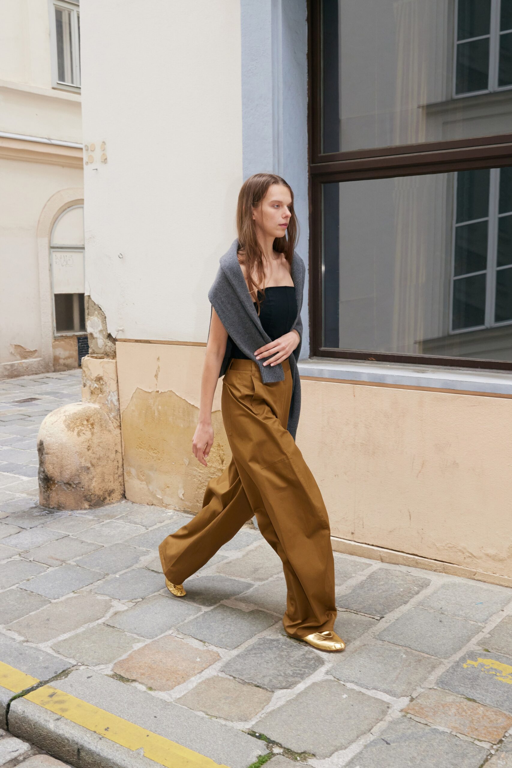 black fitted top brown wide-leg pants