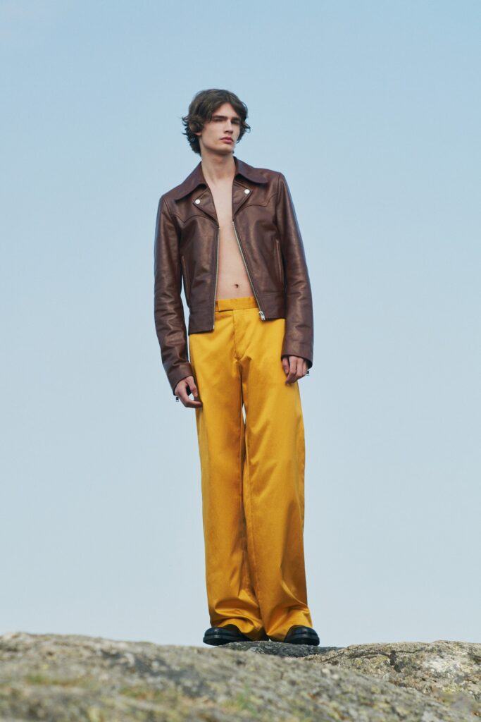 brown leather jacket and yellow pants