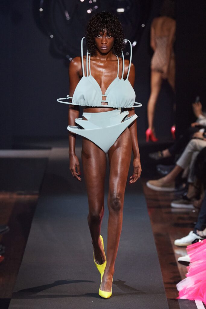 A fitted blue silk bikini with cutout details and an asymmetric design.
