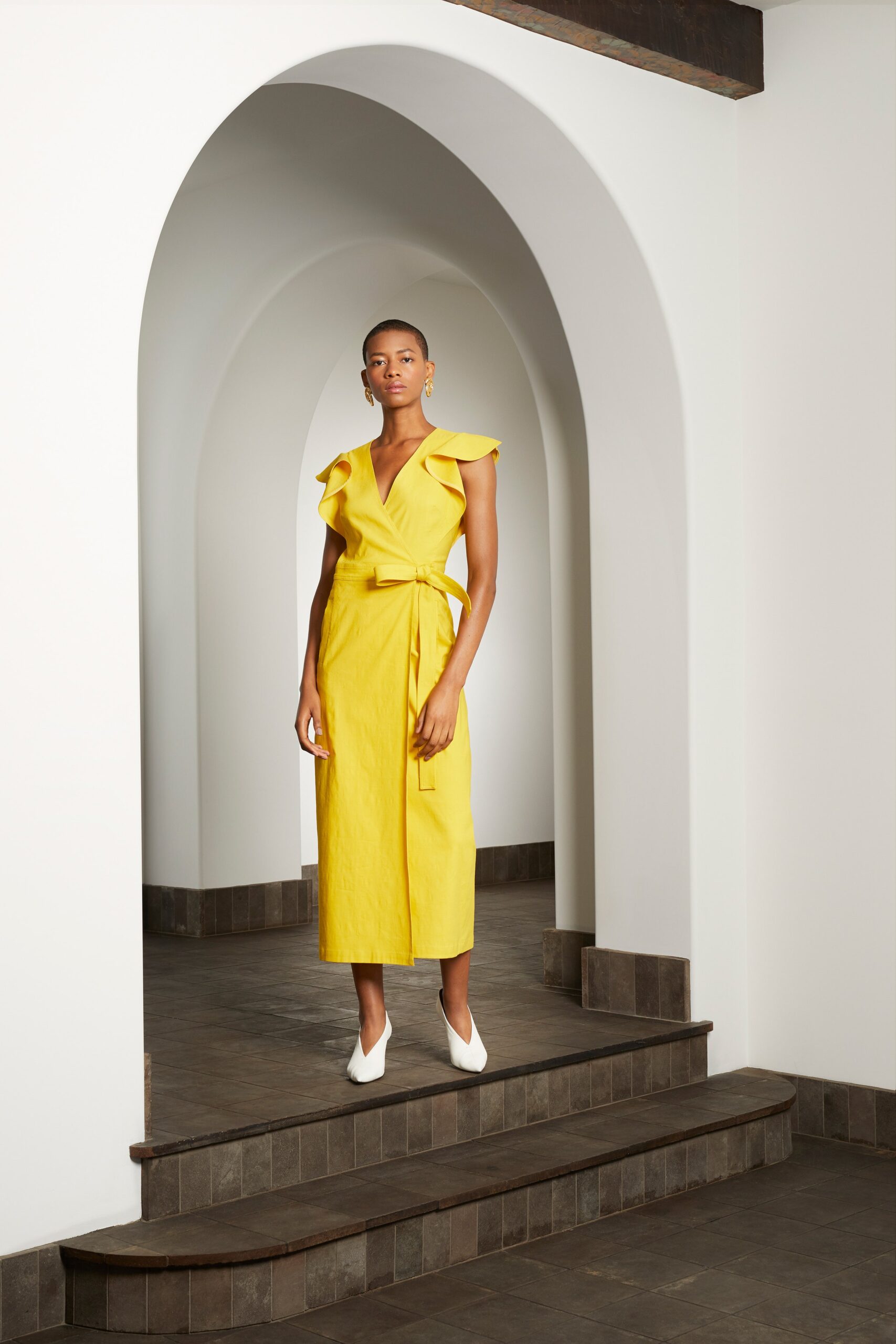 yellow cotton sleeveless v-neck fitted ruffled belted dress