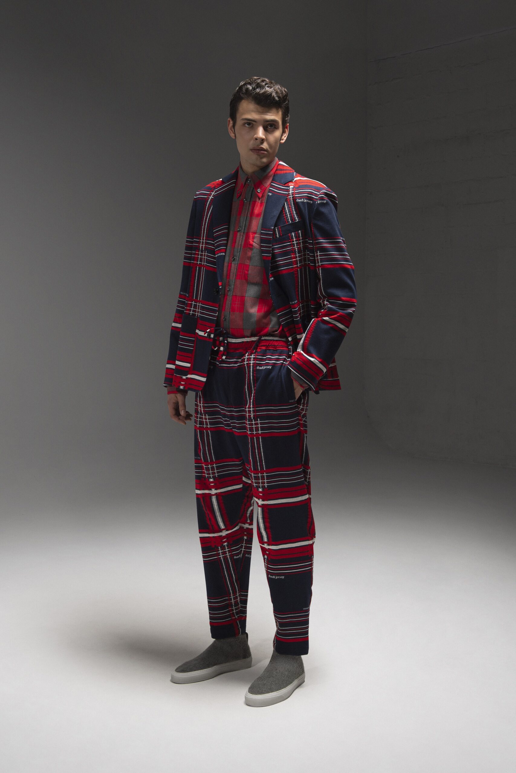 A tailored red and blue checked suit with a long-sleeve collared shirt.