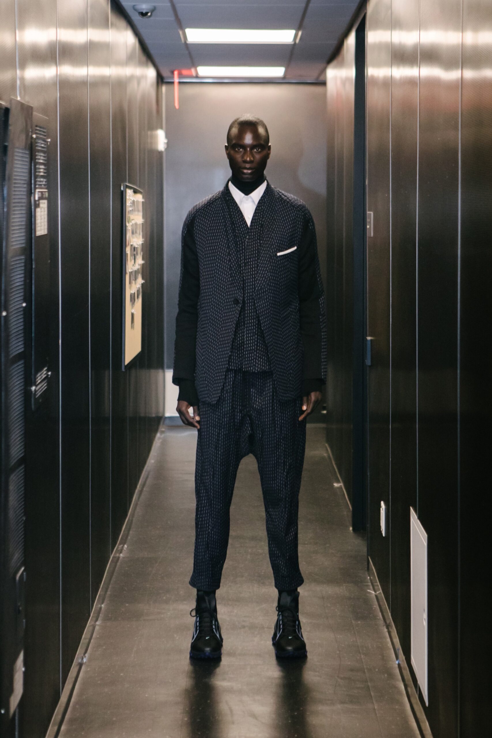 black tailored suit with pleated pants