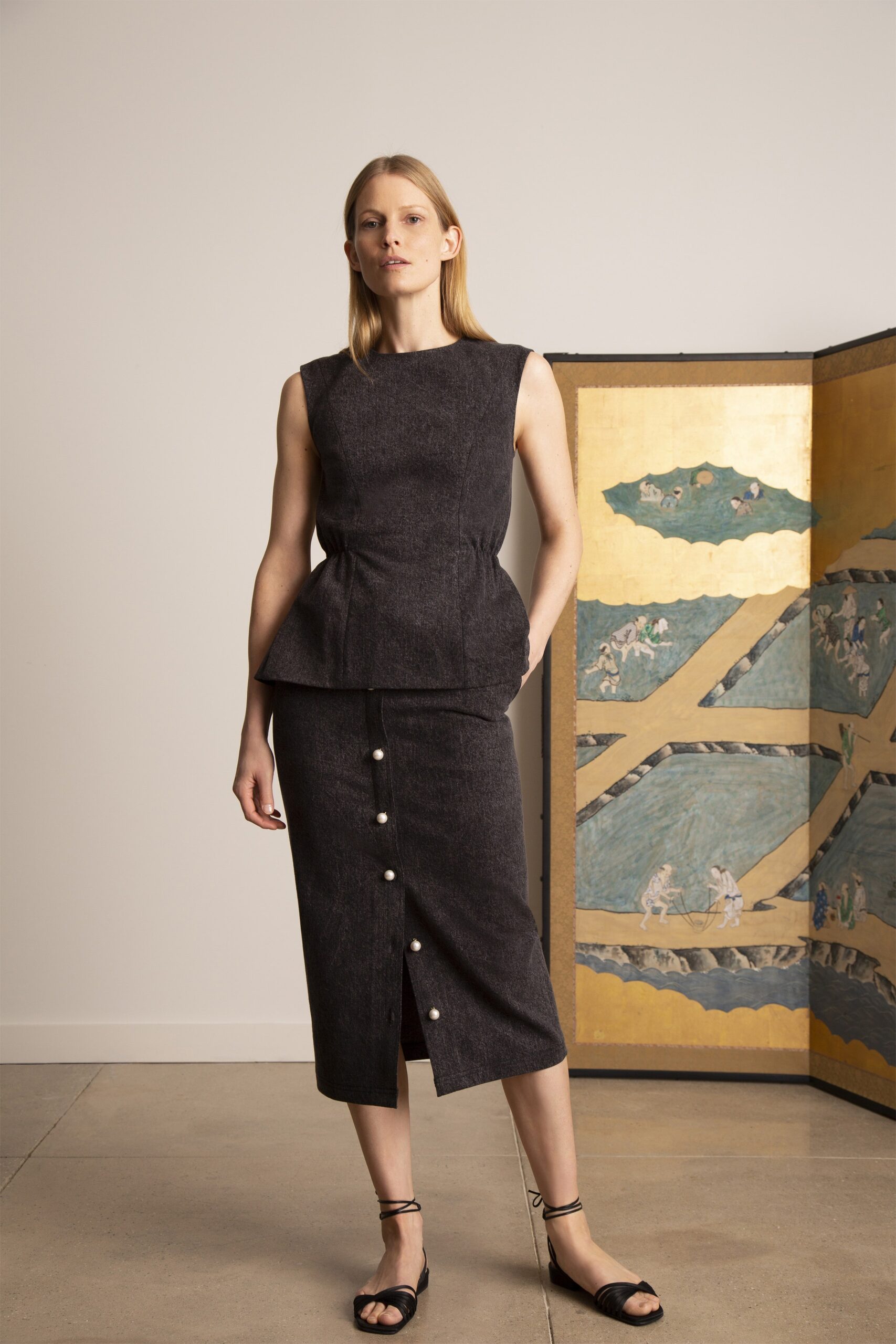 black fitted top and midi skirt