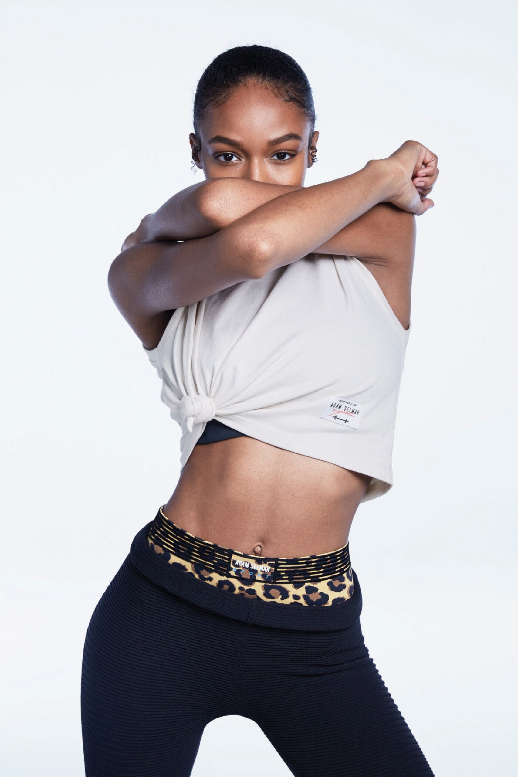 beige tank-top and printed leggings