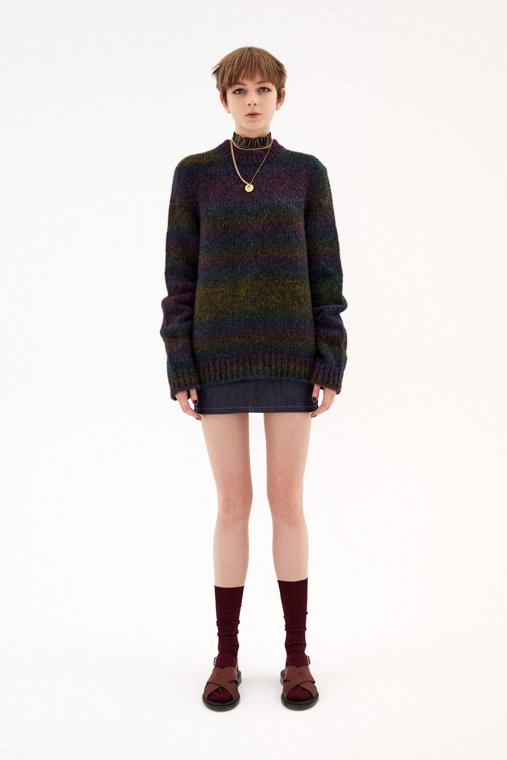 multi-colored oversized sweater with denim skirt