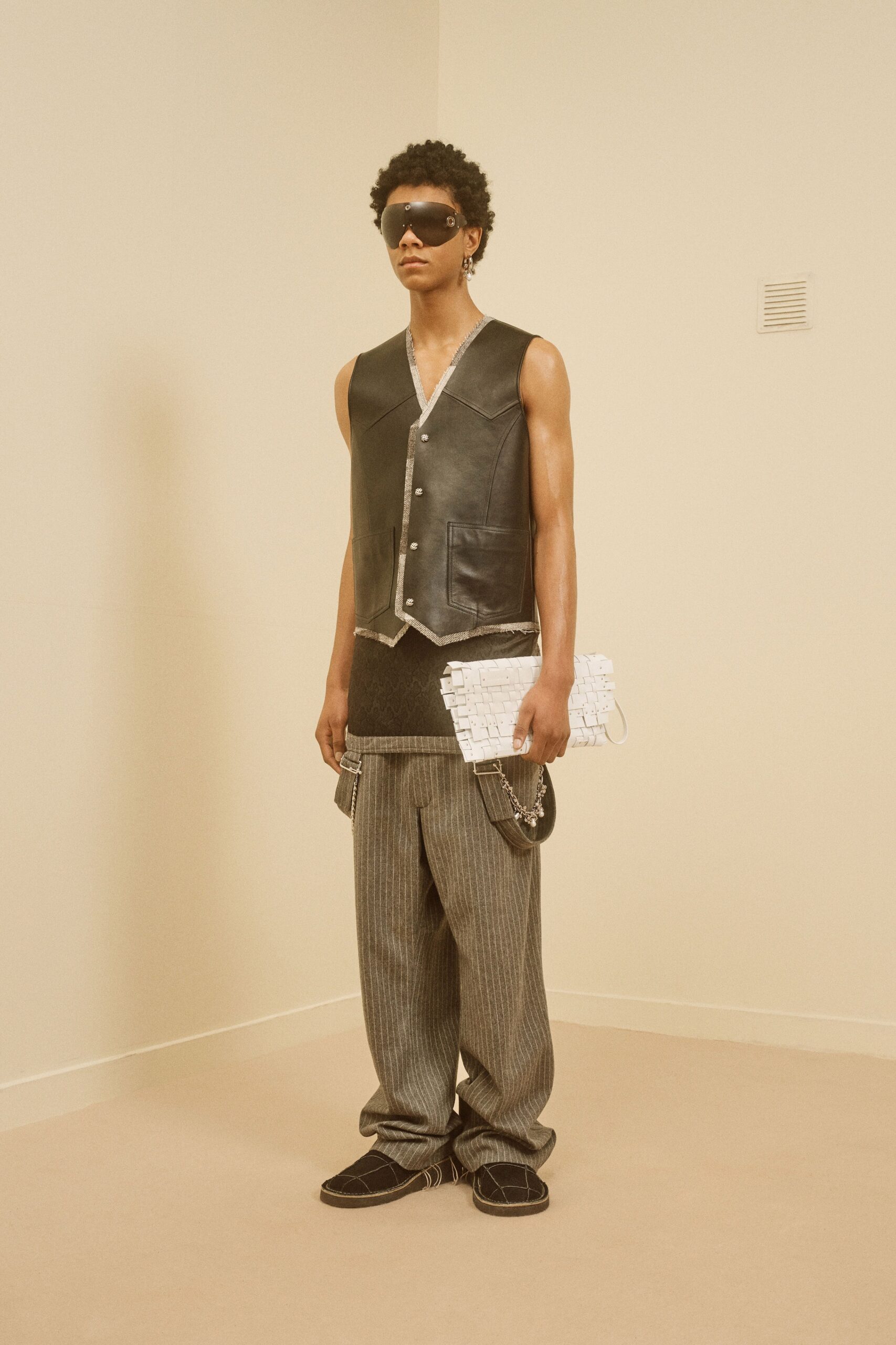black leather sleeveless v-neck fitted buttoned vest