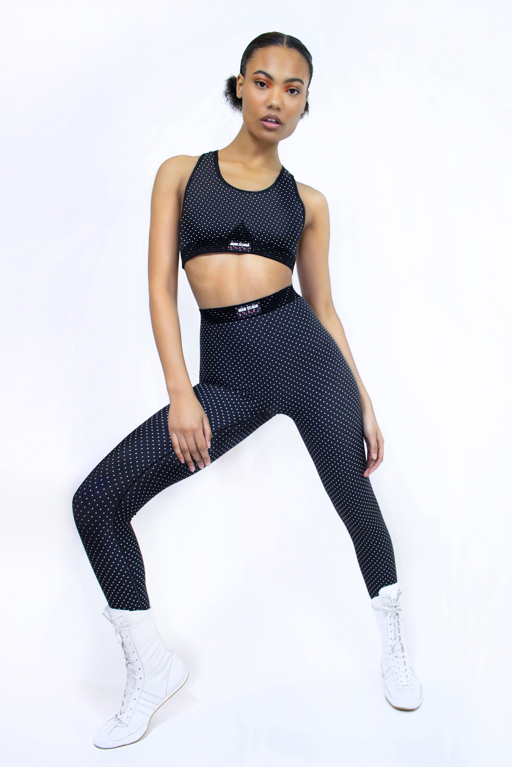 black neoprene crop-top and leggings