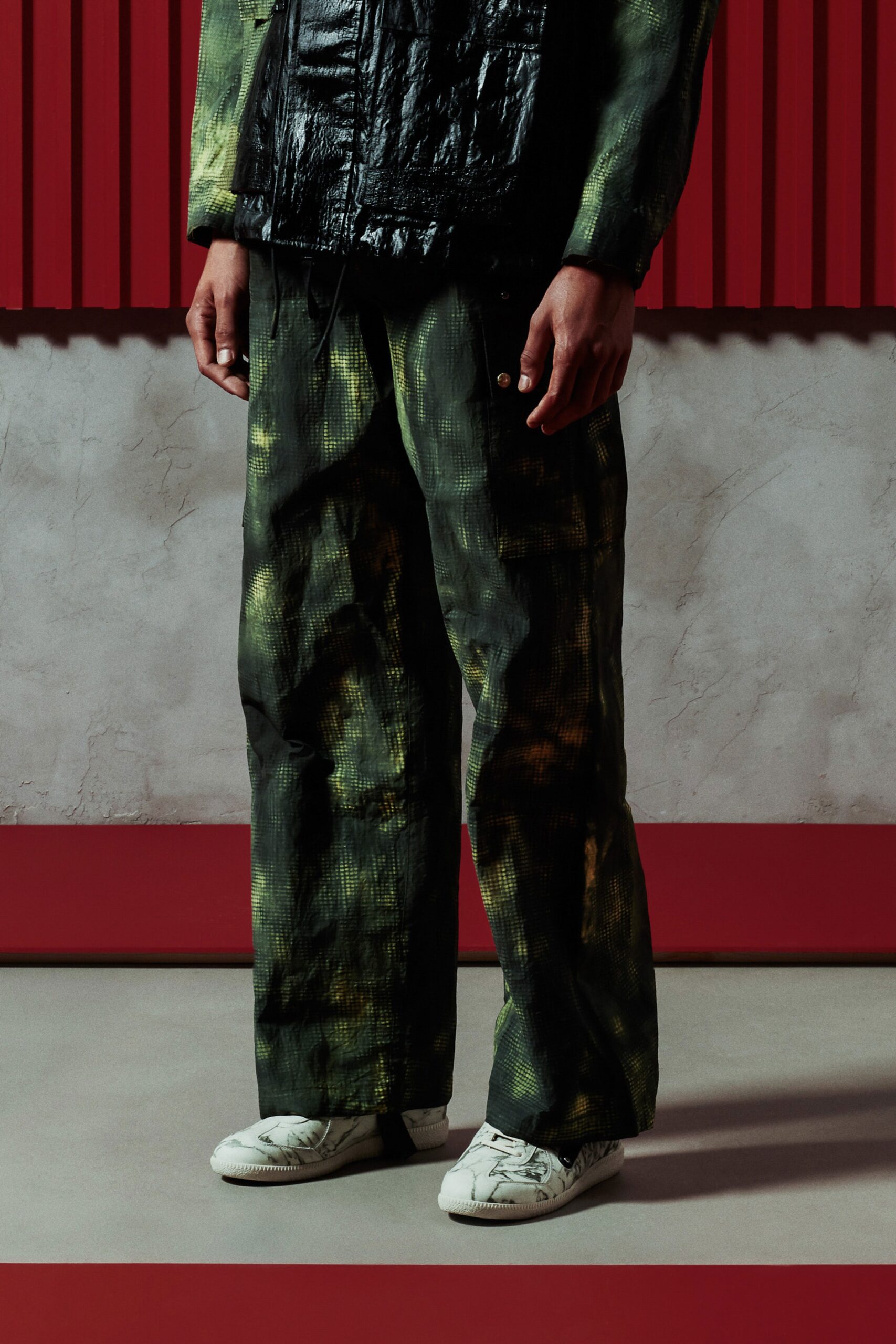 A relaxed fit green and black printed jacket paired with matching pants.
