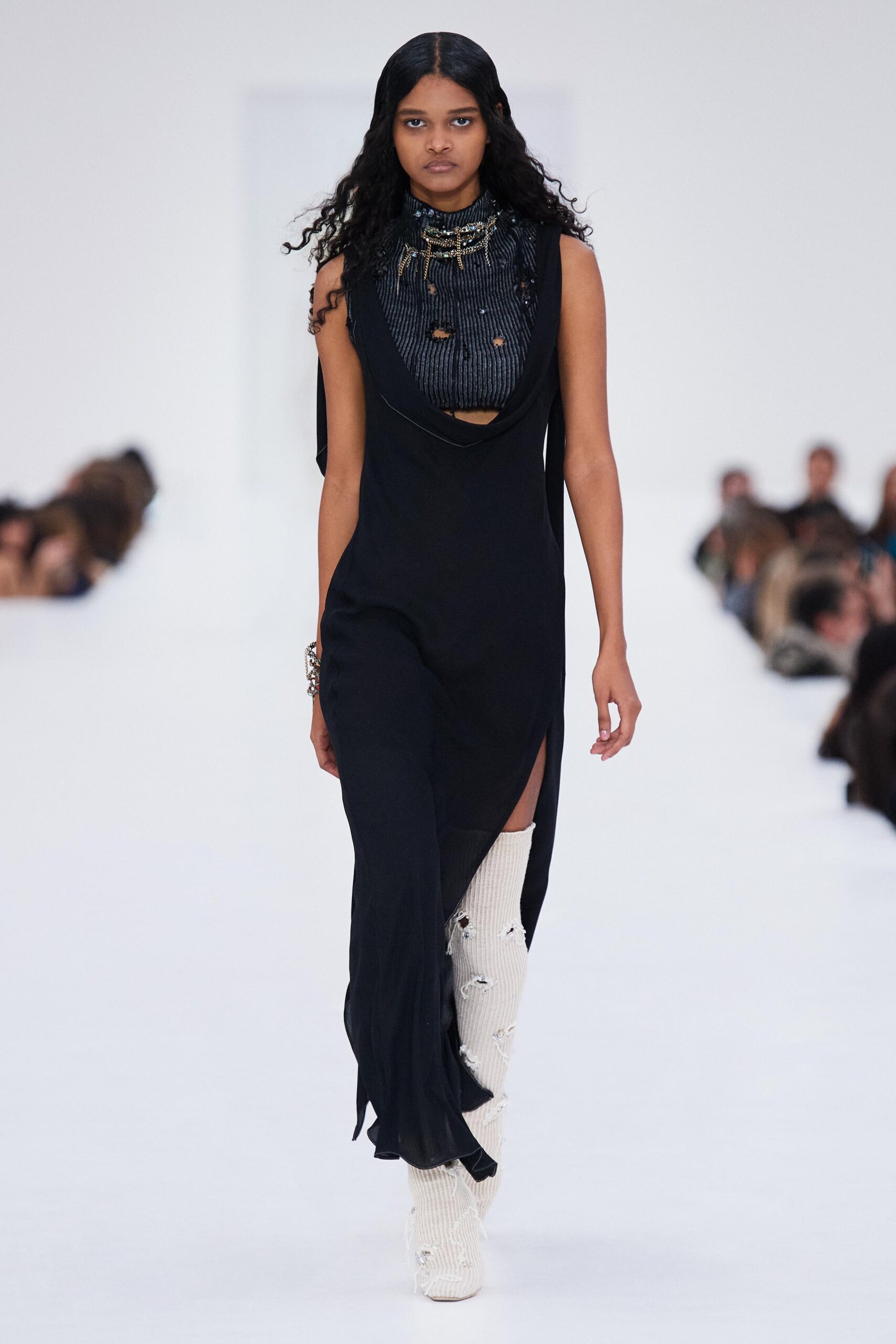 black fitted midi dress with white boots
