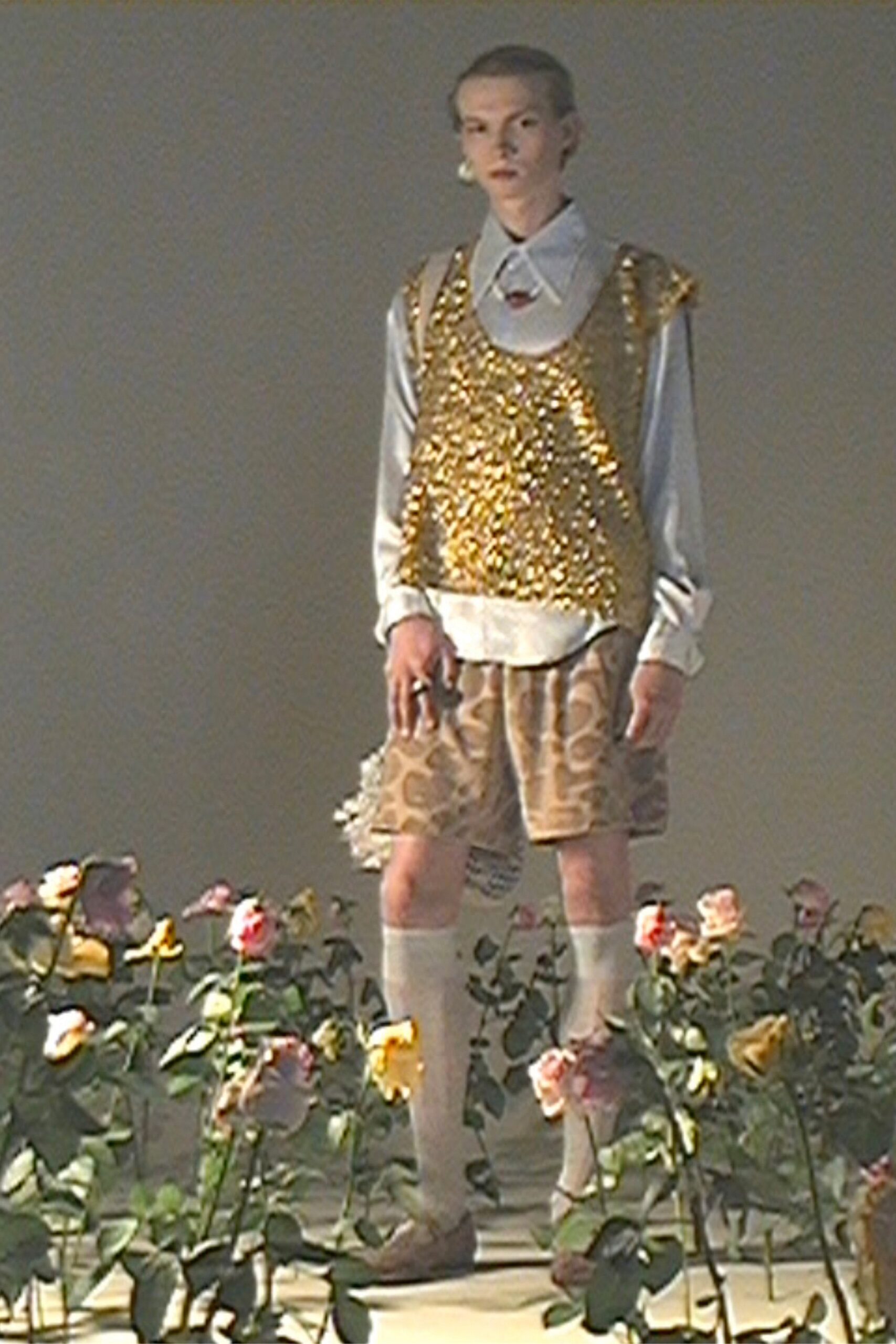 gold beaded top with brown printed shorts