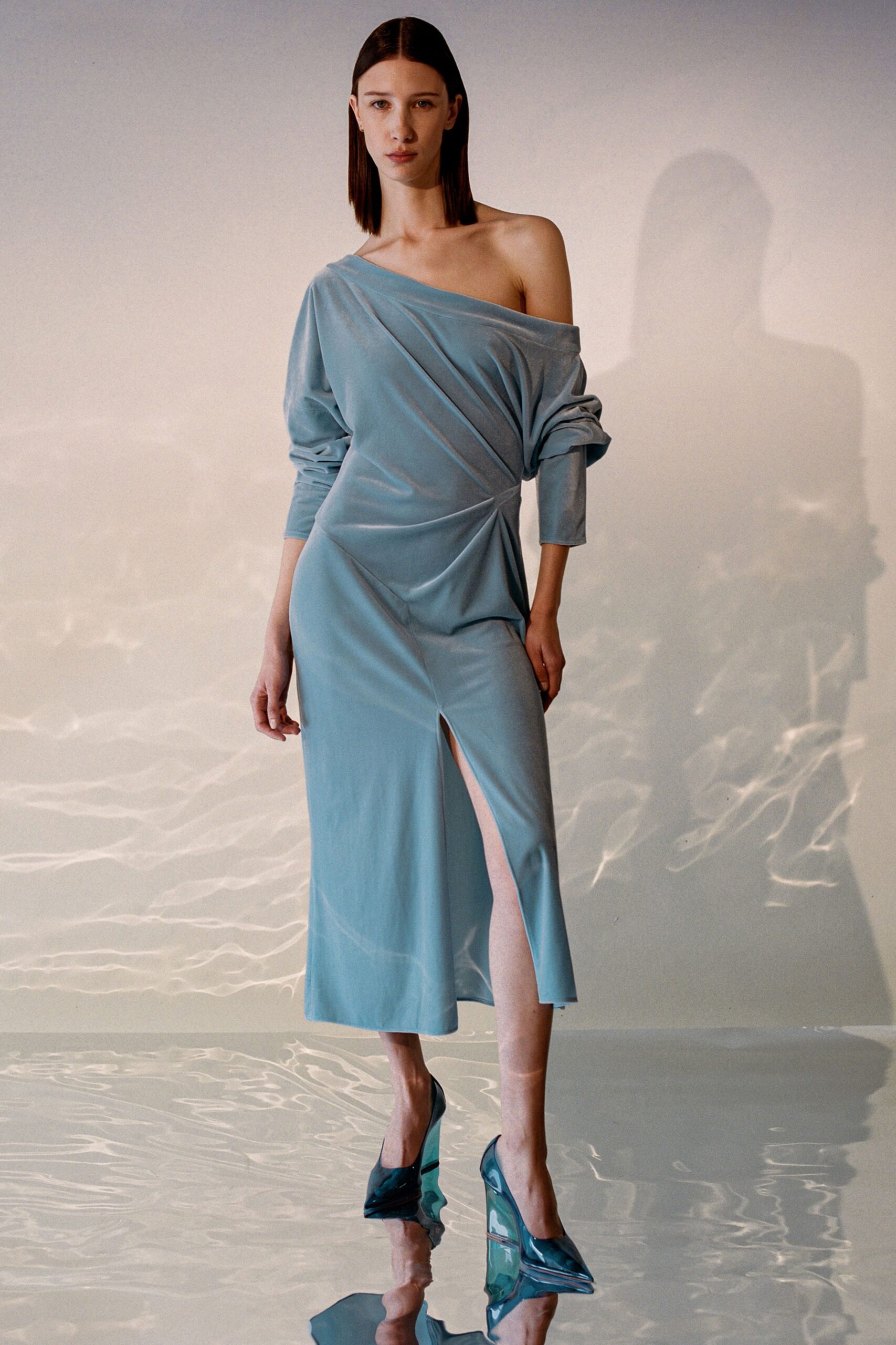 blue silk long-sleeve off-shoulder fitted draped flowing dress
