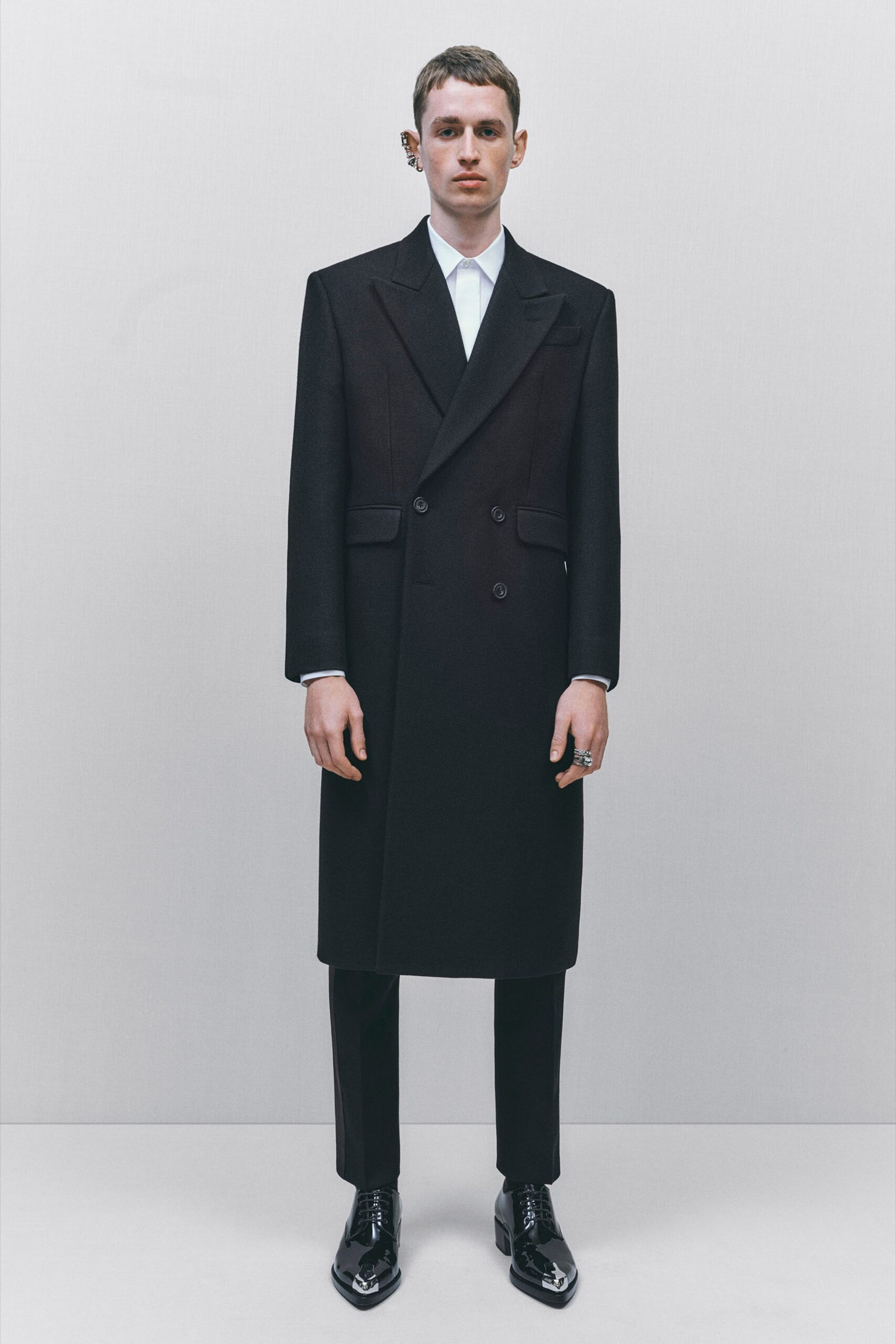 black tailored coat with white shirt