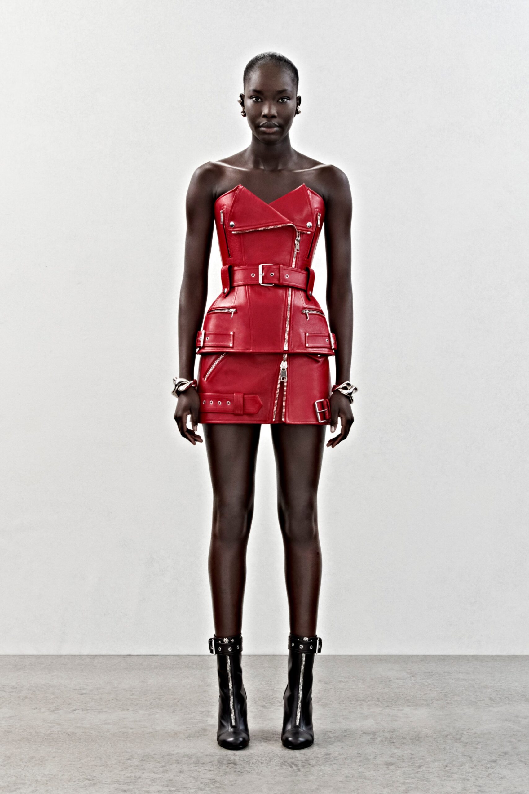 red leather sleeveless v-neck fitted zippered belted dress