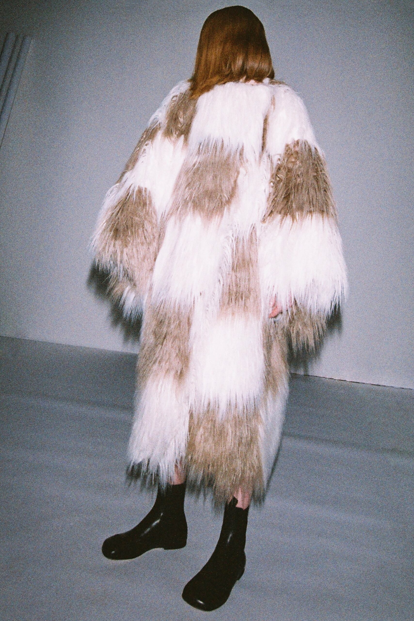 fur coat with black boots