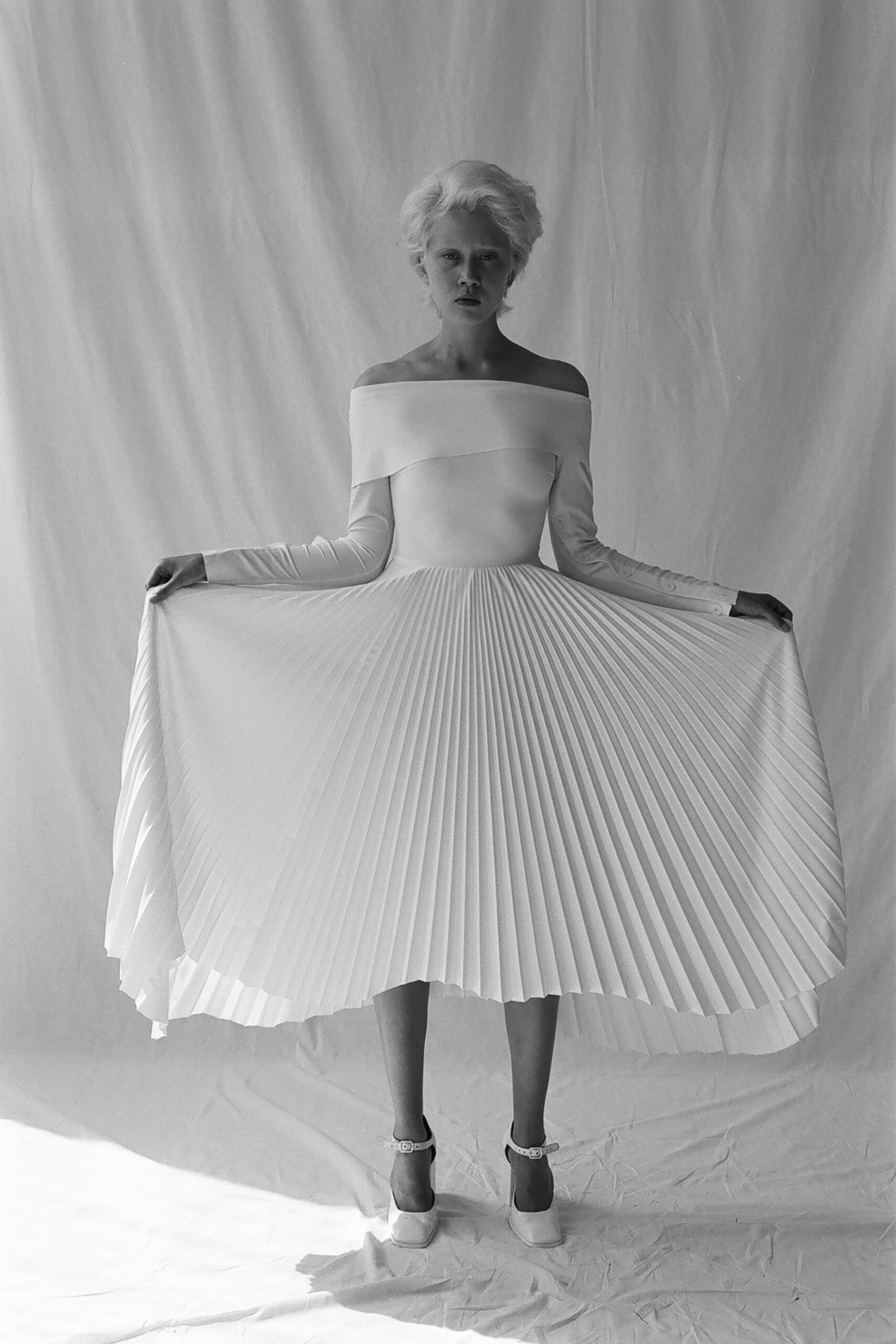 white pleated off-shoulder dress