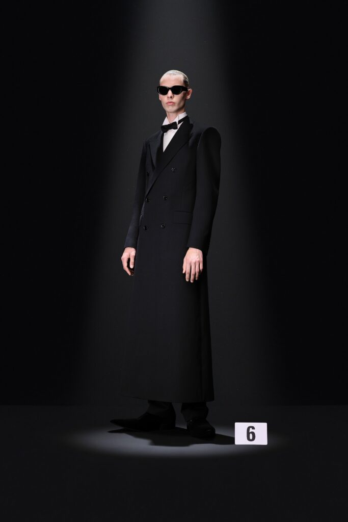 black tailored coat with sunglasses