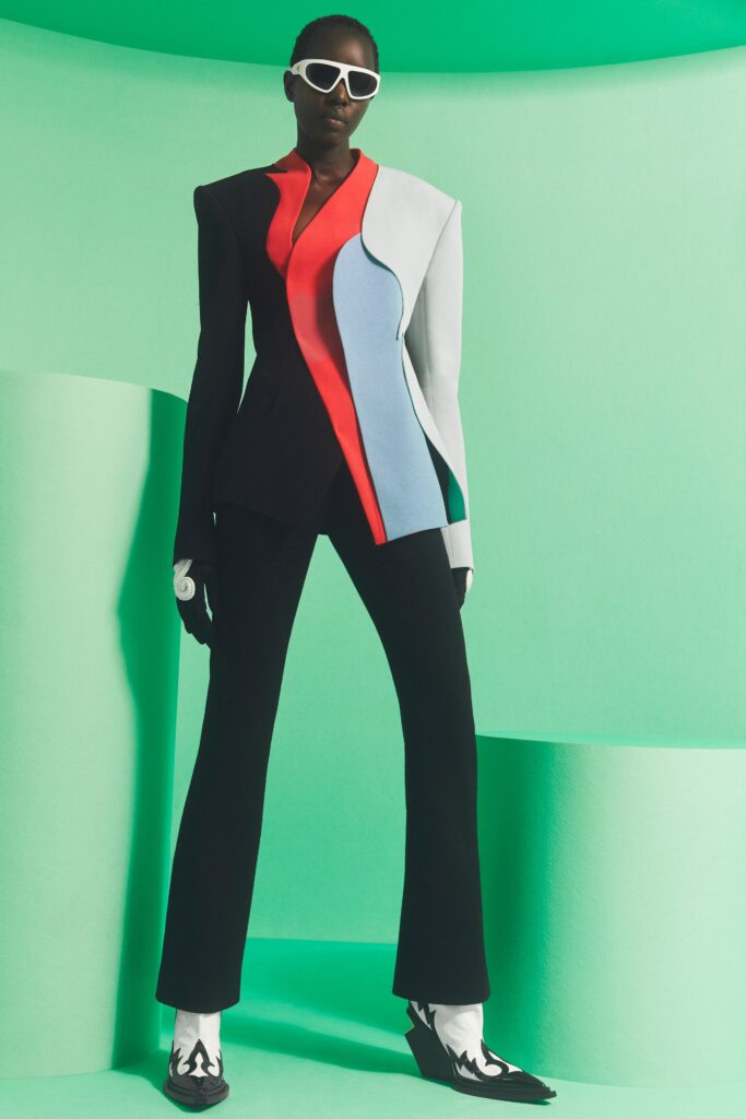 A fitted color-blocked blazer with long sleeves paired with structured pants.