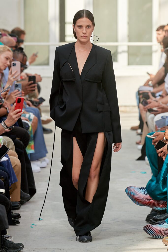 black fitted suit with slits