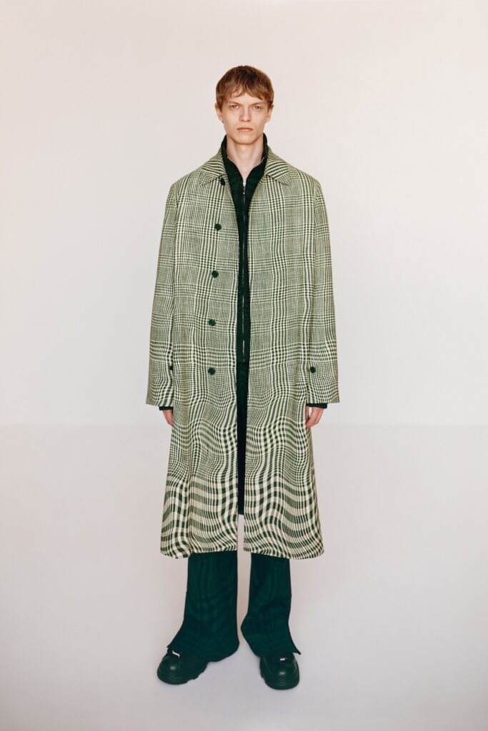 A relaxed green checked coat with long sleeves and a collared design.