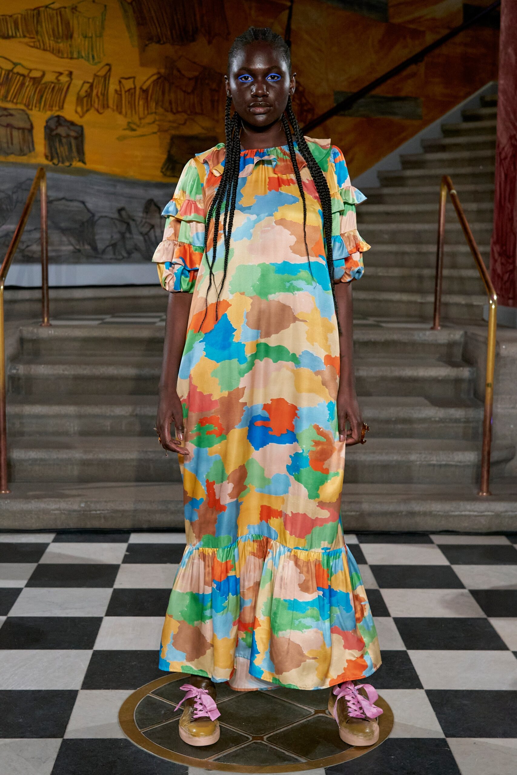 A relaxed multicolor dress with short sleeves and a tiered design.