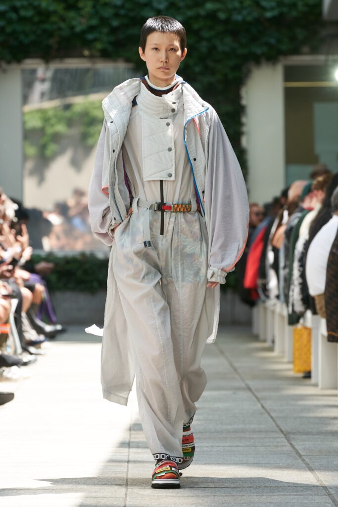 A relaxed gray jacket with long sleeves and a collared design paired with matching pants.