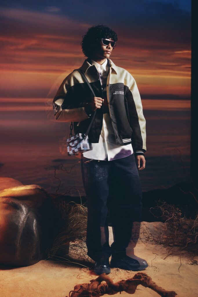 A relaxed black and white jacket with long sleeves and collared design paired with relaxed pants.