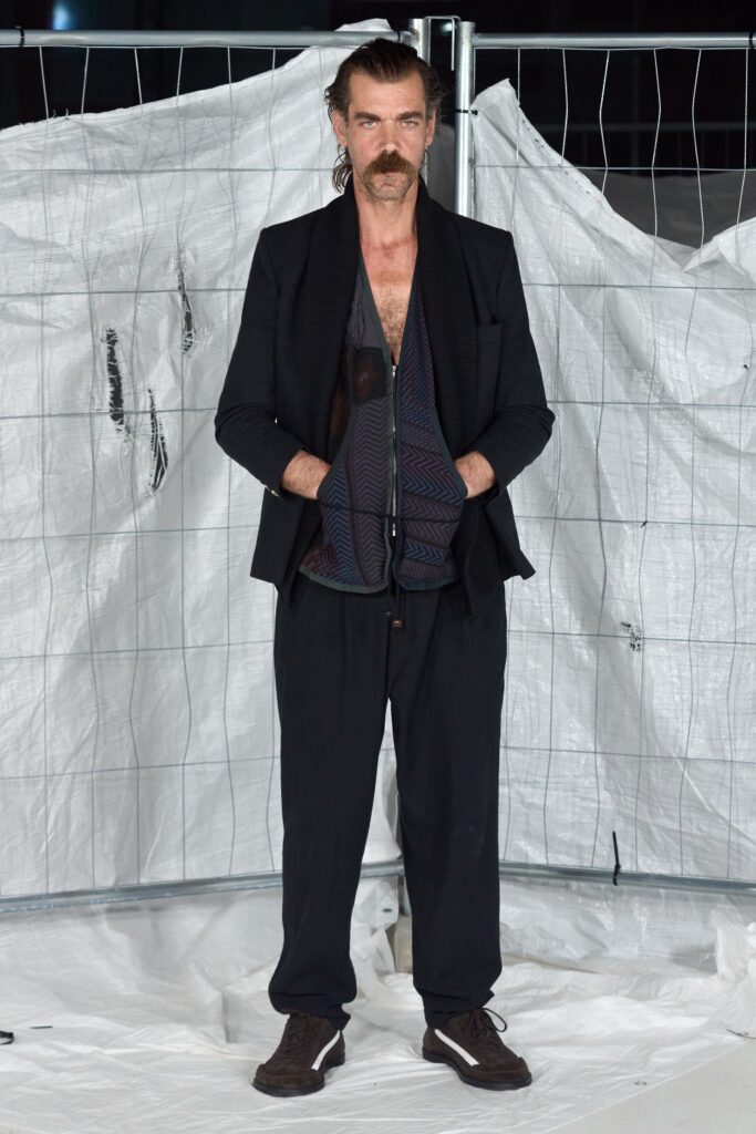 black tailored blazer with relaxed pants