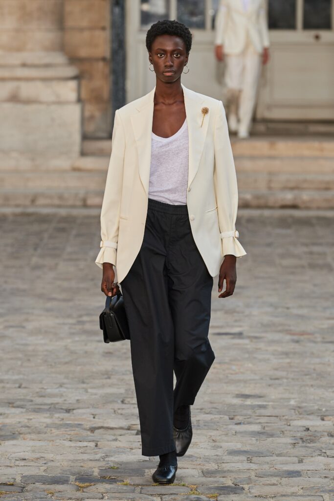 white tailored blazer with black pants