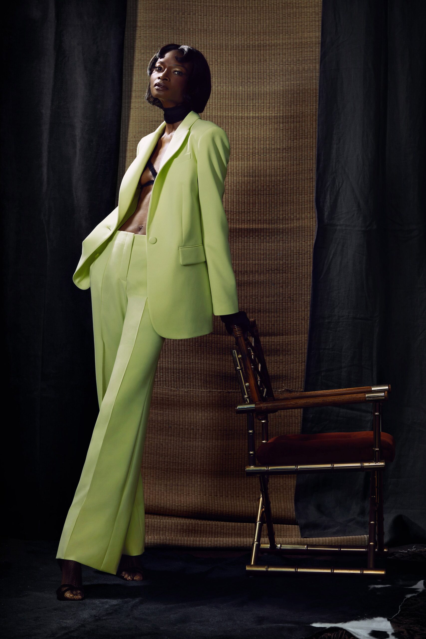 A tailored green blazer paired with straight-leg pants, creating a chic and modern look.