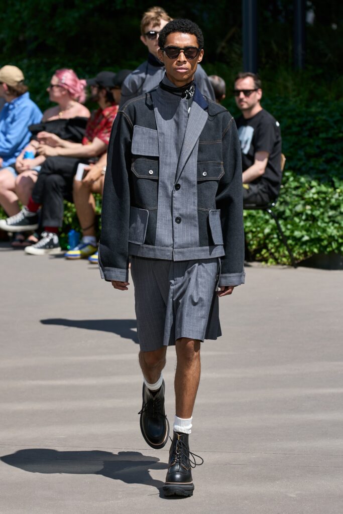 A relaxed black and gray jacket paired with matching shorts, featuring a collared design.
