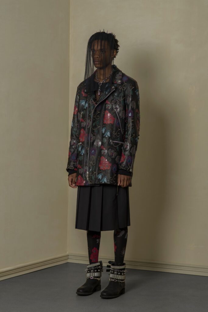 A relaxed fit multicolor printed jacket with a collared long-sleeve and a flared skirt.