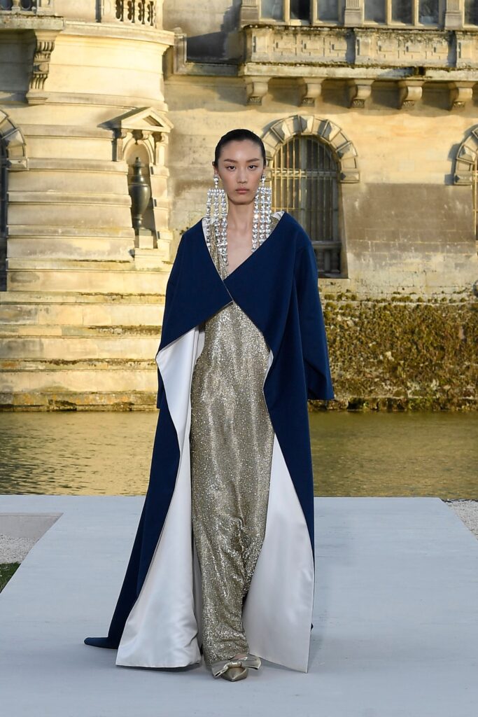 gold silk gown with navy cape